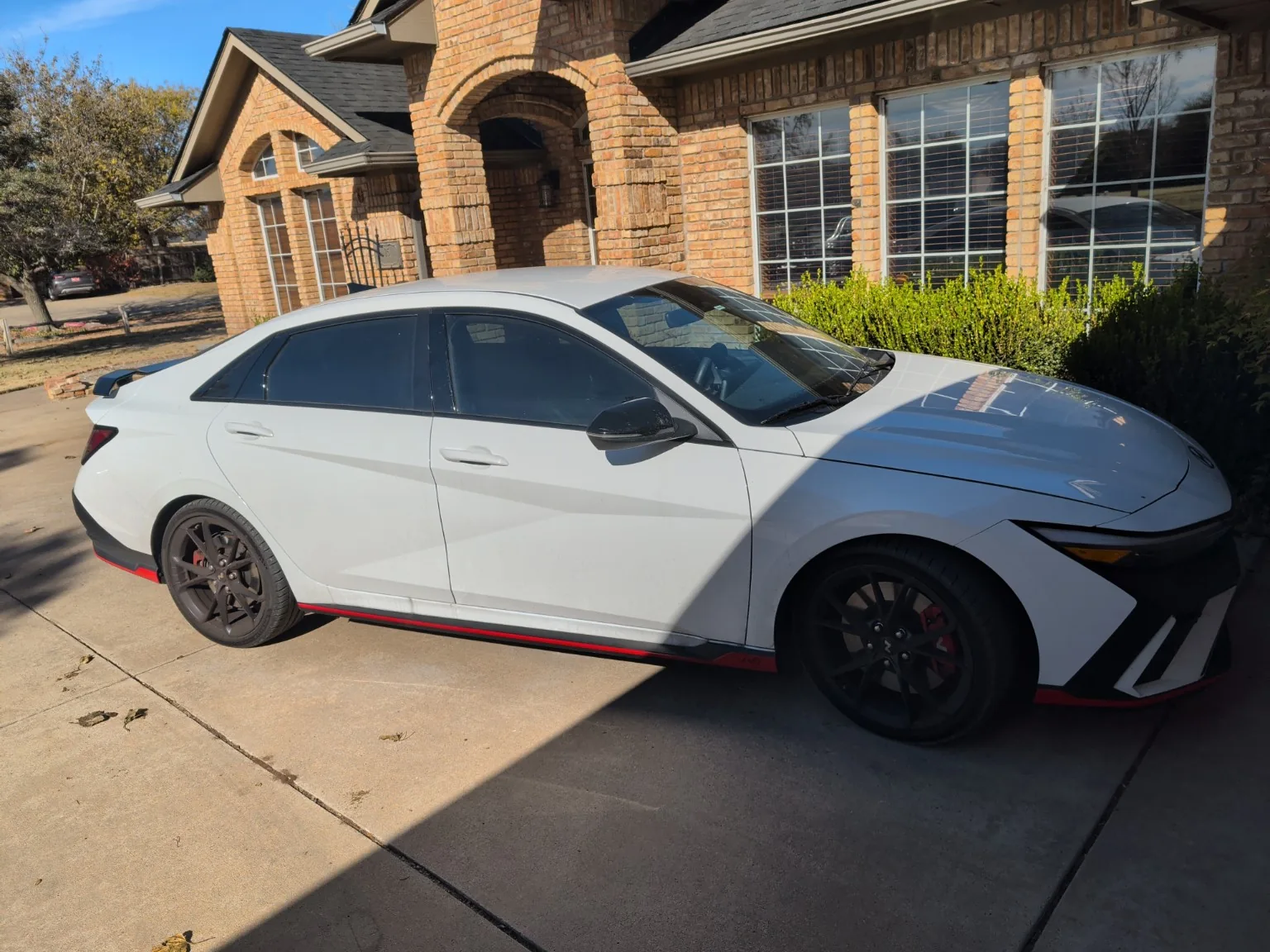 Driver-side profile with black/red N accents