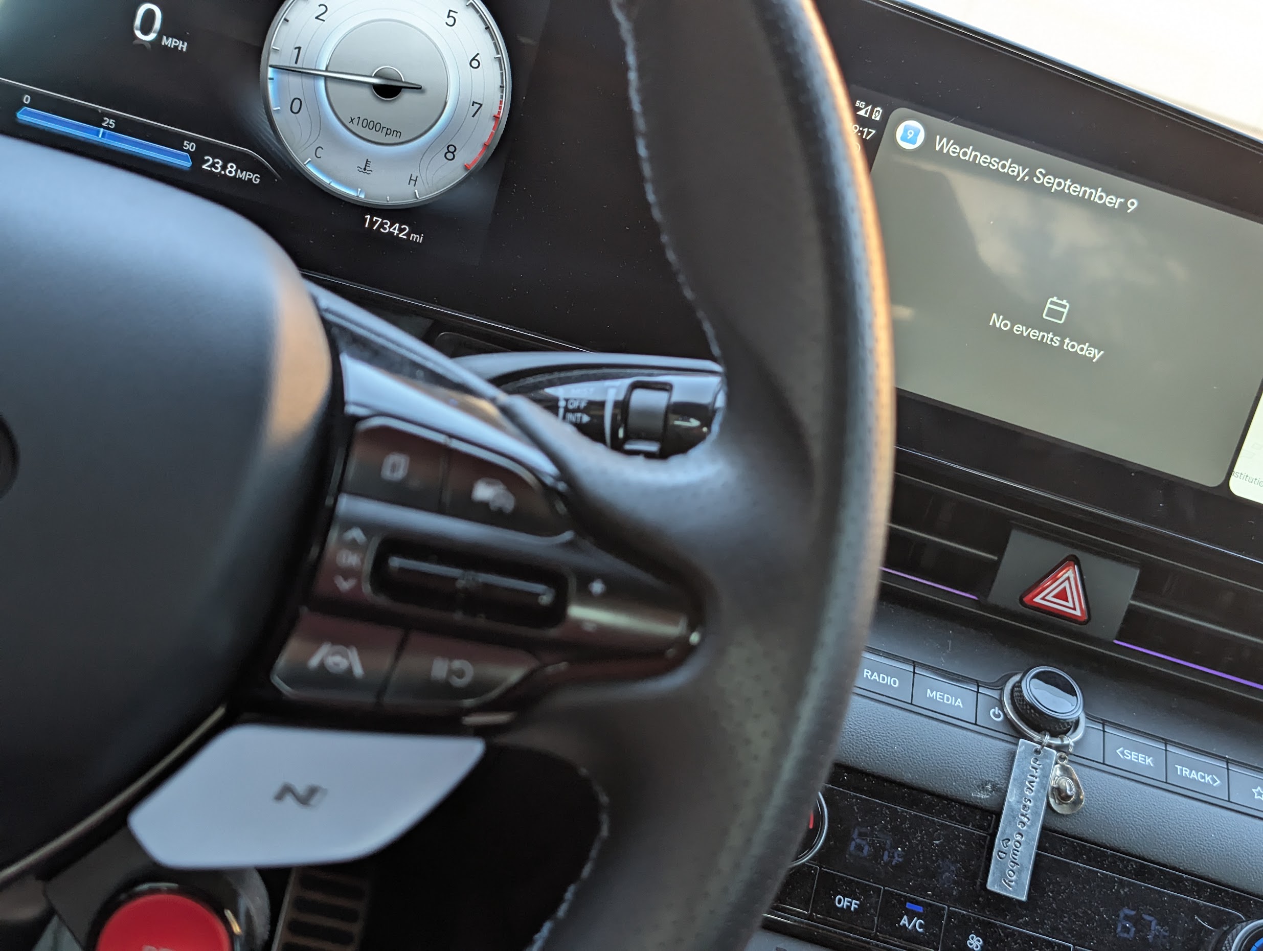 Steering wheel and odometer showing 17,342 miles and 0 MPH, with Wednesday September 9 visible on Android Auto Calendar
